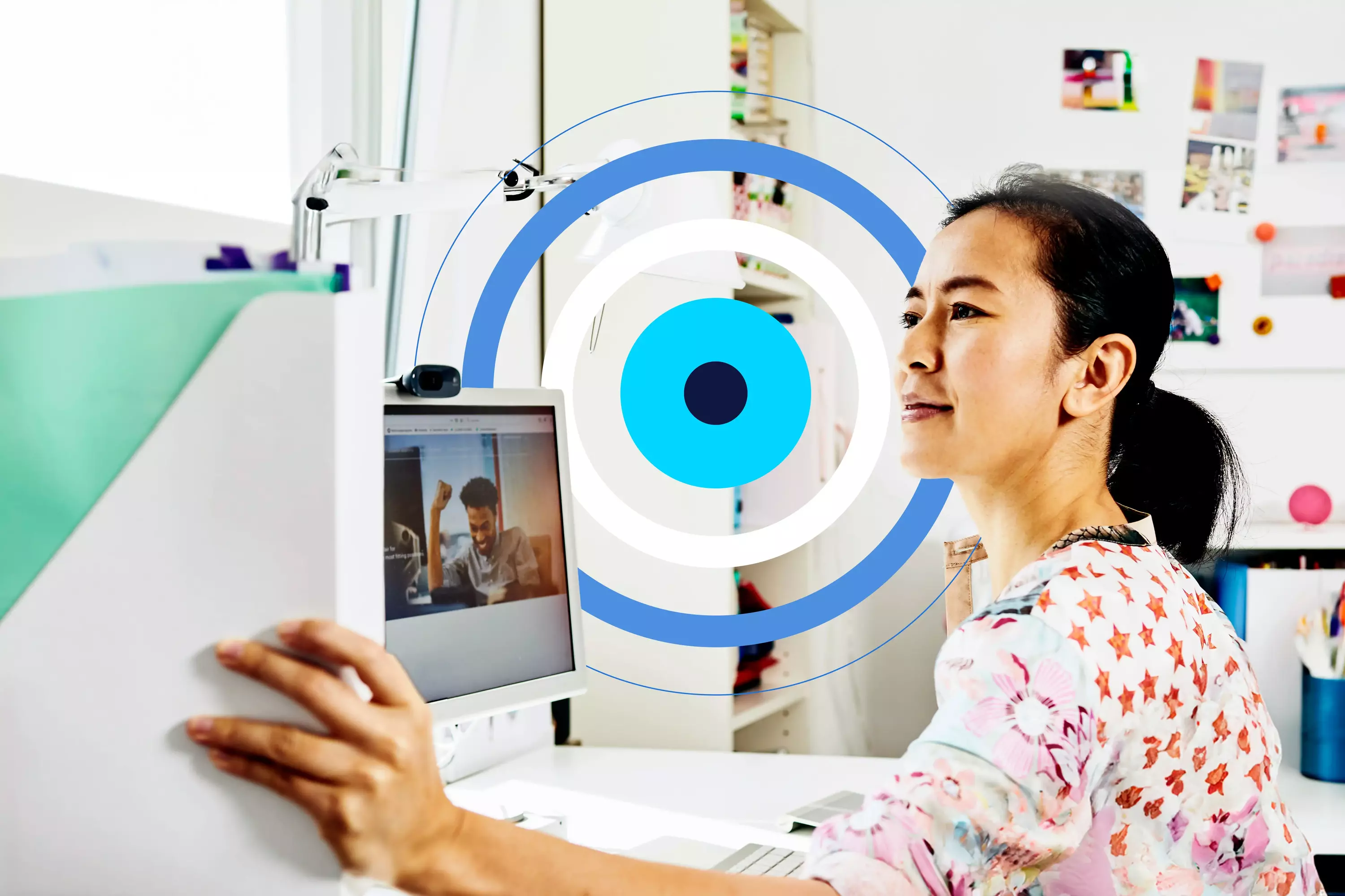 woman getting a folder sitting at her desk with a blue, cyan and white circular illustration in the background