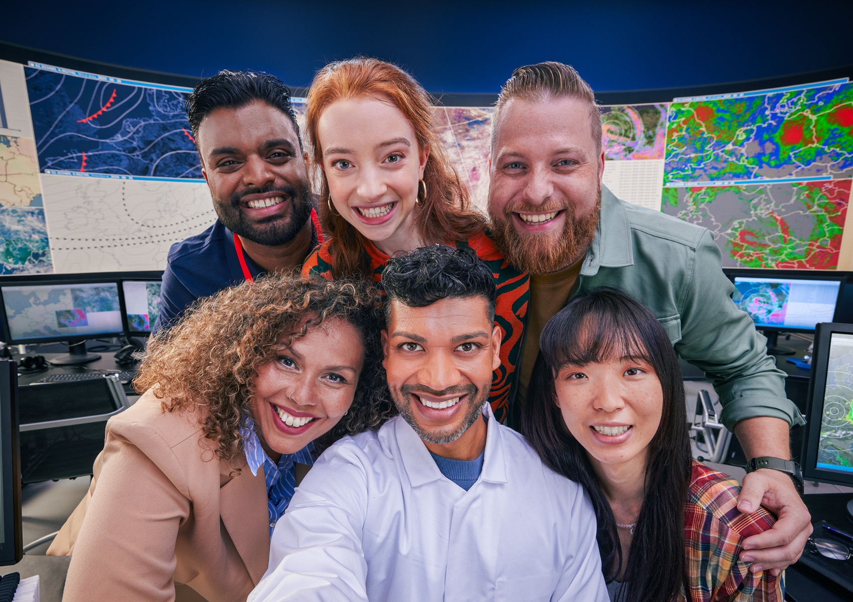 an image of a group six coworkers smiling brightly