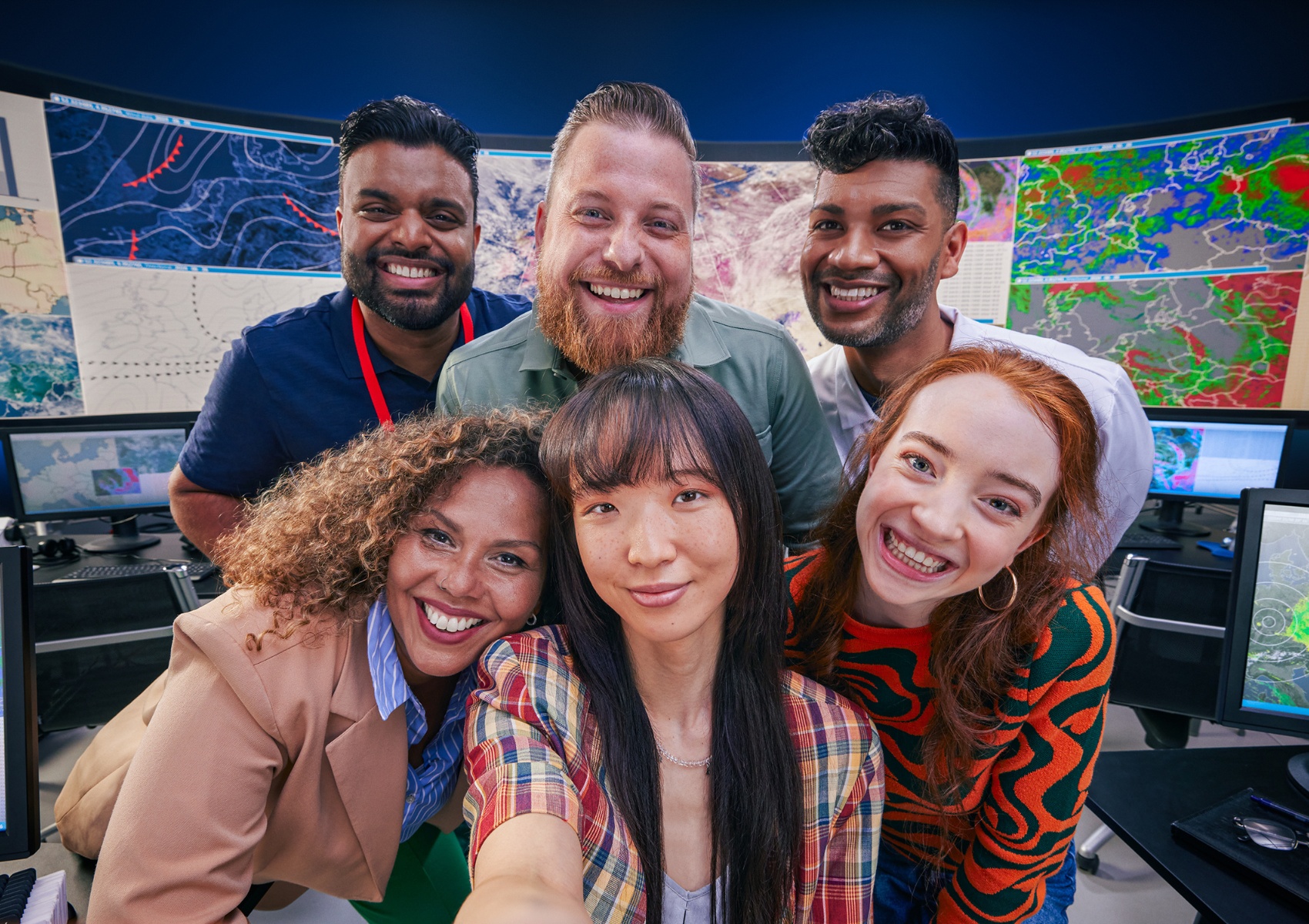 an image of a group six coworkers smiling brightly