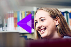 image of a girl smiling with a bookshelf behind her