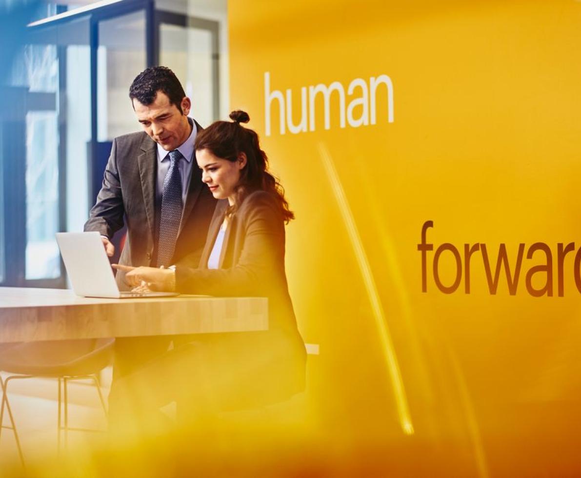Man and woman looking at a laptop Man and woman looking at a laptop